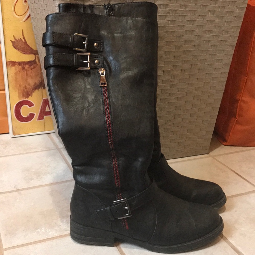 Knee high boots with red zipper accent